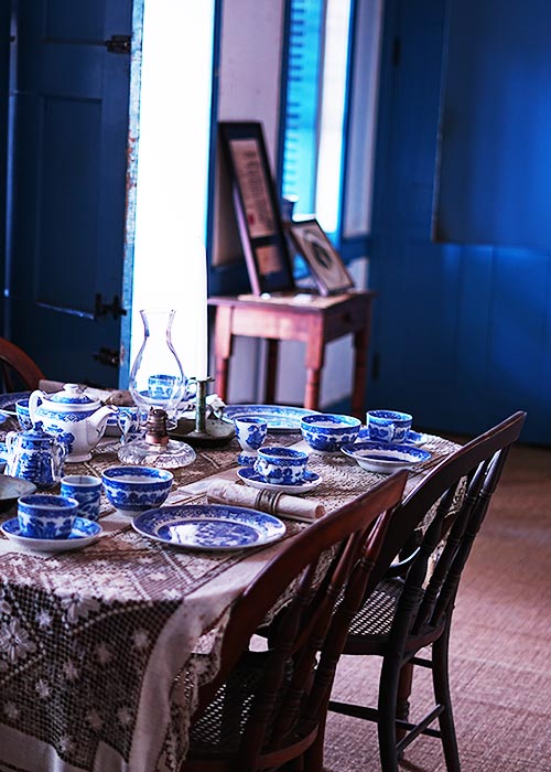 image of the dining table and flatware at the Baldwin Home Museum. 